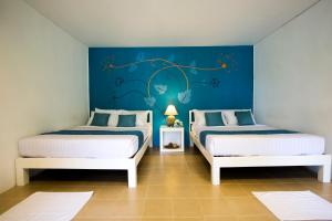 Postel nebo postele na pokoji v ubytování The C Samet Beach Resort SHA Plus + 37 fotografií