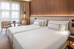Кровать или кровати в номере Hotel Meliá Bilbao