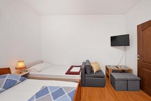 Ein Bett oder Betten in einem Zimmer der Unterkunft Apartments Dulabic