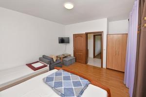Ein Bett oder Betten in einem Zimmer der Unterkunft Apartments Dulabic
