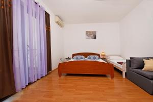 Ein Bett oder Betten in einem Zimmer der Unterkunft Apartments Dulabic