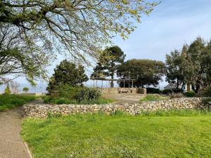 a stone wall in front of a house at Victorian Villa, Hunstanton Norfolk Sleeps 20 in Hunstanton