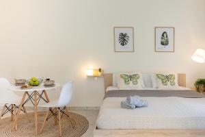 a bedroom with a bed and a table and a table at Beyond in Argostoli
