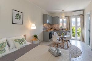 a bedroom with a large bed and a kitchen at Beyond in Argostoli
