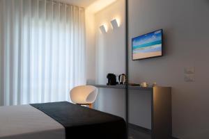 Posteľ alebo postele v izbe v ubytovaní Hotel Mediterraneo Ombrellone e Lettini Inclusi