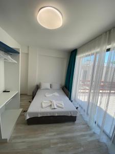 Sunny Beach Potos客房内的一张或多张床位