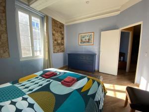 Postel nebo postele na pokoji v ubytování Résidence Verdi - Appartements meublés en centre ville
