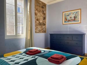 Postel nebo postele na pokoji v ubytování Résidence Verdi - Appartements meublés en centre ville
