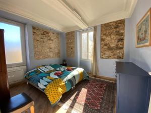 Postel nebo postele na pokoji v ubytování Résidence Verdi - Appartements meublés en centre ville