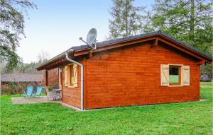 a small house with a satellite on top of it at Lovely Home In Merzalben With Wifi in Merzalben