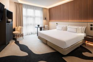 Кровать или кровати в номере Hotel Meliá Bilbao