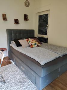 Tempat tidur dalam kamar di Apartman Vitko Divčigora