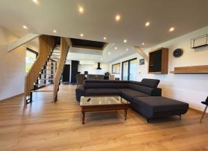 a living room with a couch and a coffee table at maison Porzh Loaz. in Plouézec +22 photos
