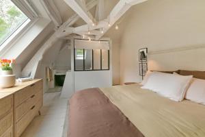 Postel nebo postele na pokoji v ubytování Le Cottage du Haras - Petite maison au calme