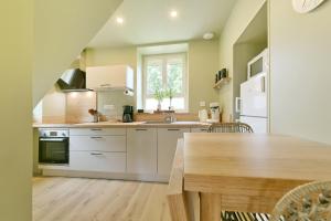 Kuchyň nebo kuchyňský kout v ubytování Le Cottage du Haras - Petite maison au calme