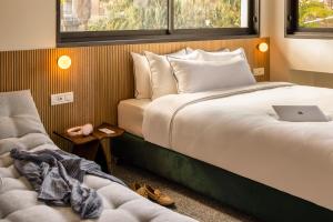 Postel nebo postele na pokoji v ubytování Savanna - by Loginn Tel-Avivian hotels