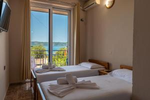 Postel nebo postele na pokoji v ubytování Hotel Nika Radhime