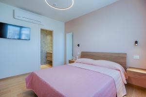 Postel nebo postele na pokoji v ubytování VillaMar Residence