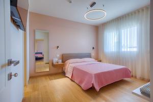 Postel nebo postele na pokoji v ubytování VillaMar Residence