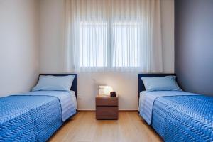 Postel nebo postele na pokoji v ubytování VillaMar Residence