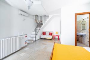 Postel nebo postele na pokoji v ubytování Casa Colombo & Casa Scipione by Rentbeat