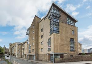 a large brick building on a city street at Old Tolbooth Wynd - 388 in Edinburgh