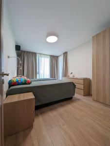 Katil atau katil-katil dalam bilik di Foros Apartment