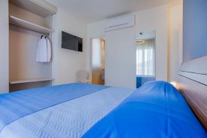 Postel nebo postele na pokoji v ubytování VillaMar Residence