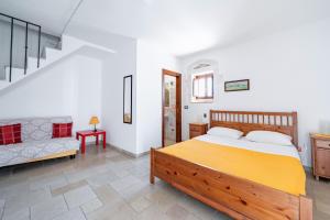 Postel nebo postele na pokoji v ubytování Casa Colombo & Casa Scipione by Rentbeat