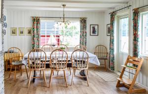 a dining room with a table and chairs at Lovely Home In Garnes With Wifi in Garnes