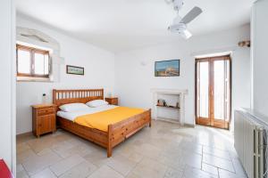 Postel nebo postele na pokoji v ubytování Casa Colombo & Casa Scipione by Rentbeat