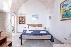 Postel nebo postele na pokoji v ubytování Casa Colombo & Casa Scipione by Rentbeat