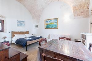 Postel nebo postele na pokoji v ubytování Casa Colombo & Casa Scipione by Rentbeat