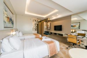 TV a/nebo společenská místnost v ubytování Zuri Hotel