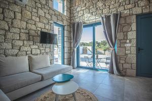 Posezení v ubytování Anasa Rustic Villa