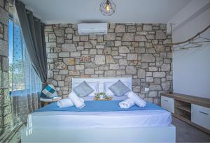 Postel nebo postele na pokoji v ubytování Anasa Rustic Villa