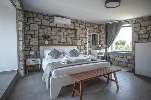Postel nebo postele na pokoji v ubytování Anasa Rustic Villa