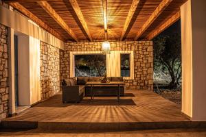 Posezení v ubytování Anasa Rustic Villa