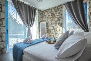 Postel nebo postele na pokoji v ubytování Anasa Rustic Villa