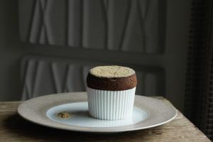 a cupcake on a plate on a table at Thalazur Arcachon in Arcachon
