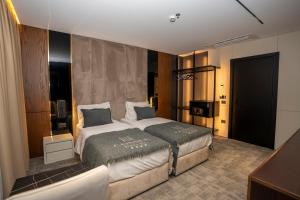 Łóżko lub łóżka w pokoju w obiekcie Hotel Consul