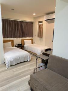 Letto o letti in una camera di Tianmu Star Urban Living