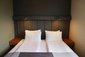 Ένα ή περισσότερα κρεβάτια σε δωμάτιο στο Fosshotel Hellnar