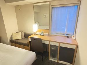 Postel nebo postele na pokoji v ubytování Hotel Sunflex Kagoshima
