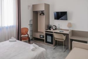 Postel nebo postele na pokoji v ubytování La Regina dAlabastro