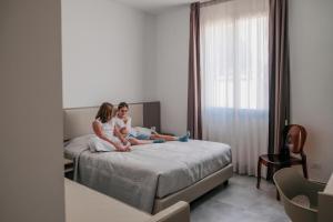 Postel nebo postele na pokoji v ubytování La Regina dAlabastro