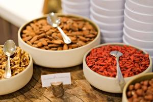 a table topped with bowls of nuts and dried beans at Thalazur Arcachon in Arcachon
