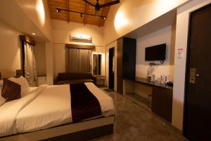 Letto o letti in una camera di Freesia Resort by Express Inn