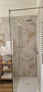 a shower with a glass door in a bathroom at MARY ROSE - Locazione Turistica in Brindisi