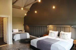 Ένα ή περισσότερα κρεβάτια σε δωμάτιο στο Fosshotel Hellnar